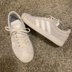 Gray and white adidas sneakers